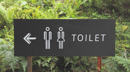 Sign with directions to bathroom