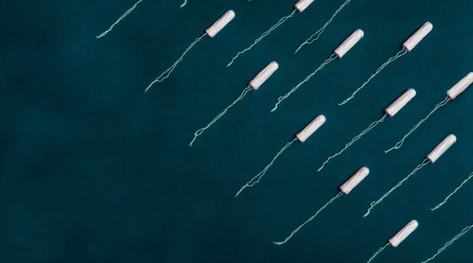 Tampons arranged on blue surface