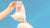 Woman holding bra in the air