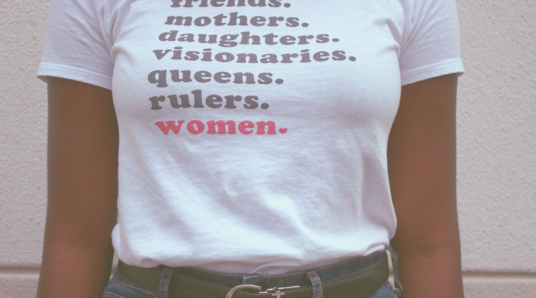 Woman wearing shirt with empowering messages