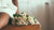 Woman sitting on table with bouquet of roses