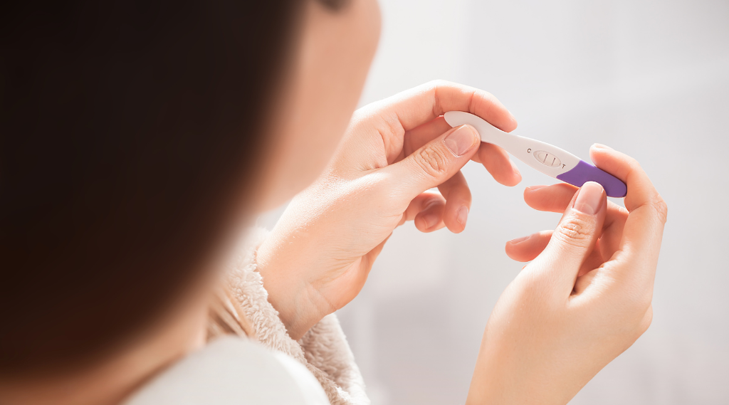 Is it possible to be pregnant and still have a period?